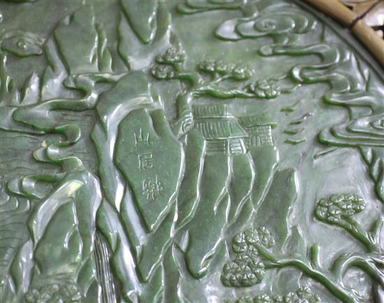 A large Chinese spinach green jade and wood table screen panel, 20th century, total size including wood frame 67 x 53cm, stand lacking